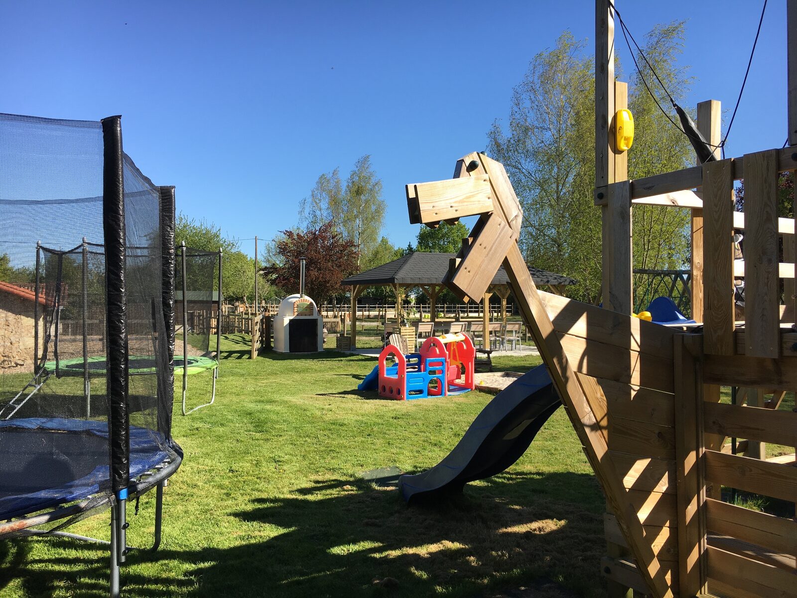 Outdoor playground and trampoline at Lac de Maison